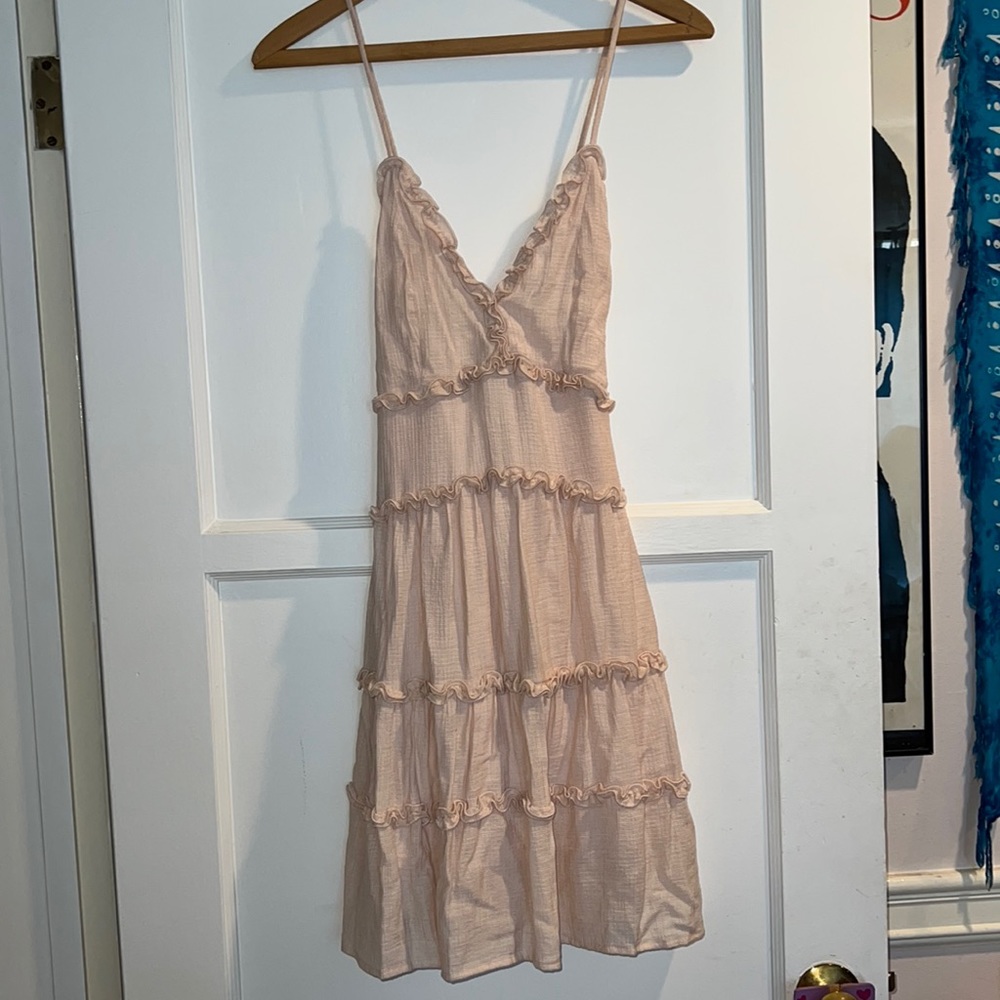 Dress pink with ruffles and crisscross back